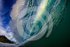 Surfing ocean wave in barrel