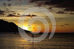 Surfing at sundown, Beau Vallon, Seychelles