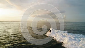 Surfing: Surfer man riding on the blue waves slow motion