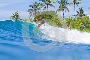 Surfing a Wave. Bali Island. Indonesia.