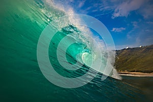 Surfing wave green blue barrel in Hawaii