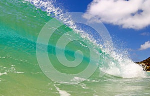 Surfing Wave in the Pacific Ocean on a Sunny Day