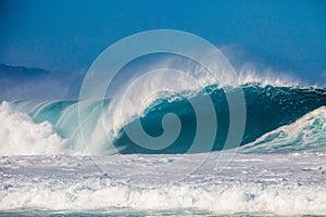 Surfing waves at Bonzai Pipeline on the North Shore of Oahu, Hawaii photo