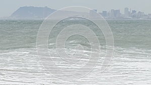 Surge with big waves, strong wind and poor visibility.