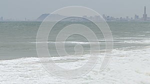 Surge with big waves, strong wind and poor visibility.