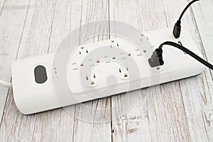 Surge protector with USB protection on weathered wood