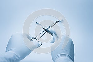 Surgeon and assistent nurse hands