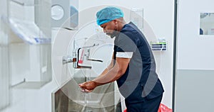 Surgeon cleaning hands, hygiene and doctor man, safety and water for washing away bacteria with healthcare. Health