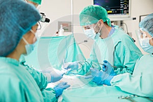 Surgeon concentrating on a patient