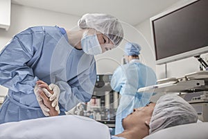 Surgeon consulting a patient, holding hands, getting ready for surgery