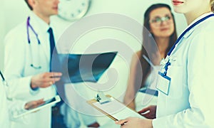 Surgeon and doctor analyzing x-ray together in medical office