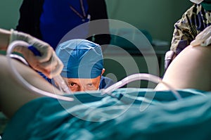 Surgeon doctor in operating room during gynecological examination