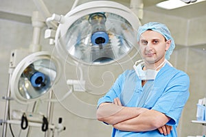 Surgeon doctor in surgery operation room photo