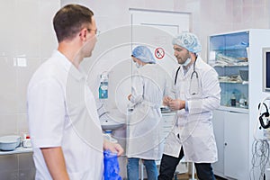 Surgeon gathered with his team of doctors before surgery