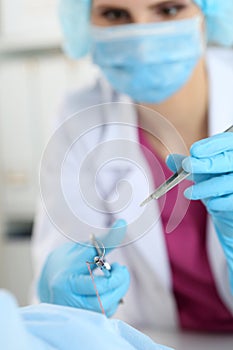 Surgeon hand hold needle, forceps and tweezers