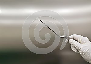 Surgeon Holding Bayonet Forceps