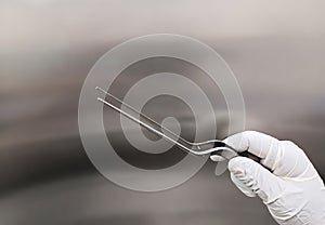 Surgeon Holding Bayonet Forceps