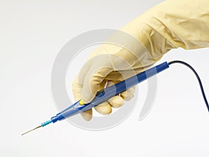 Surgeon holding a blue electric scalpel