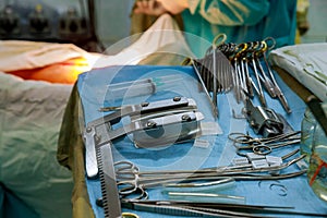 The surgeon in the instruments of surgery in operating room