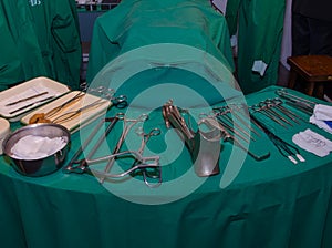 Surgeon and old surgical tools.