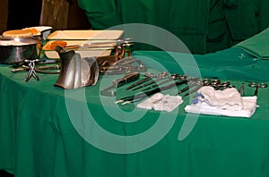 Surgeon and old surgical tools.