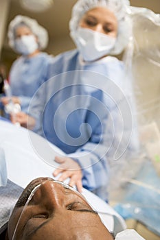 Surgeon Operating On Patient photo