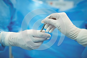 Surgeon passing scalpel to colleague in operation theater