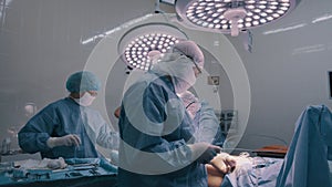 Surgeon performing an operation.