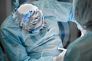 Surgeon performing plastic surgery