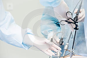 Surgeon performs laparoscopic surgery photo