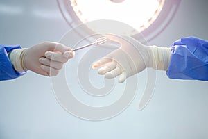 Surgeon and physician assistant team The instruments are being prepared for surgery in a hospital operating room