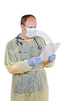 Surgeon reading clipboard