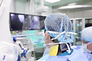 Surgeon in a special uniform at work in the X-ray laboratory.