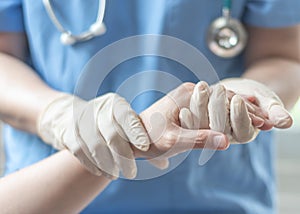 Surgeon, surgical doctor, anesthetist or anesthesiologist holding patient`s hand for health care trust and support in professional