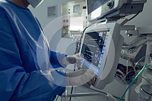 Surgeon using the medical monitor in operation theater at hospital