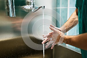 Surgeon washing hands to operation using correct technique for cleanliness