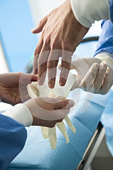 Surgeon wearing protective gloves