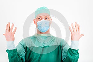 Surgeon wearing surgical mask and cap getting ready for surgery