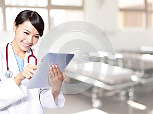 Surgeon woman doctor using tablet pc