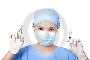 Surgeon woman holding syringe and clippers