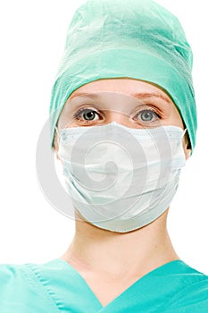 Surgeon woman in protective mask