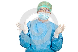 Surgeon woman showing hands in latex gloves