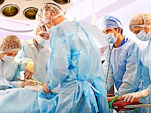 Surgeon at work in operating room. photo