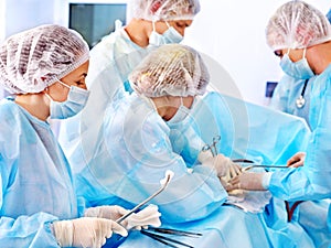 Surgeon at work in operating room.