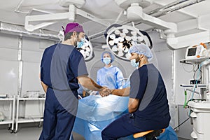 Surgeons Handshake in Operating Room