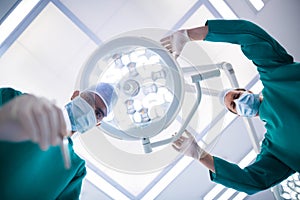 Surgeons operating in operation theater photo