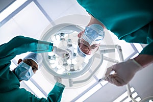 Surgeons operating in operation theater