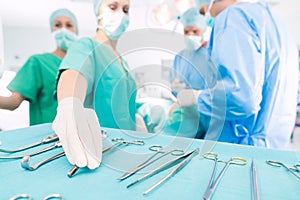 Surgeons operating patient in operating room