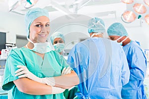 Surgeons operating patient in operation theater