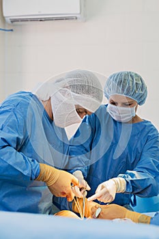 Surgeons in operating room.